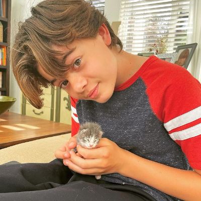 Brecken Merrill posing with his pet for his Instagram feed.